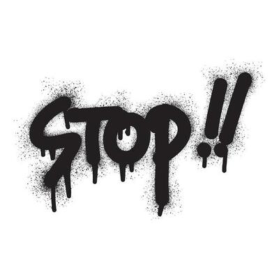 Graffiti stop text with black spray paint