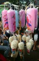 Colorful cotton candy in plastic cup photo