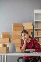 Small Business, Startup SME, Owner Entrepreneurs. Asian woman with unsuccess business online shopping crying and serious face unhappy mood. photo