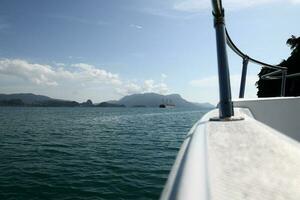 riding gliding floating flying over sea water on speedboat photo