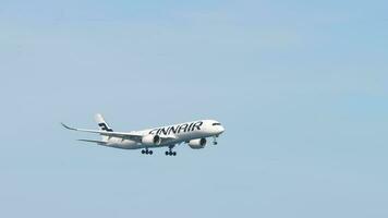 PHUKET, THAILAND FEBRUARY 12, 2023 - Airbus A350 941, OH LWF of Finnair approaching before landing at Phuket airport. Airliner flies, long shot. Tourism and travel concept video