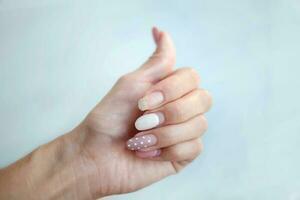 Weak thin nail. Consequences of gel polish manicure. Regrown nails after shellac. photo