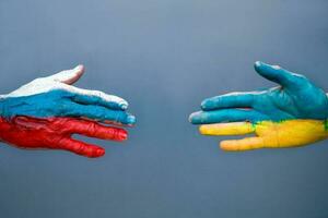 Flags of Ukraine and Russia The flag on the hands move away from each other. Conflict Ukraine vs Russia in World War Crisis Concept photo