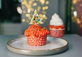 Christmas red Muffin. Background of New Year's cakes photo