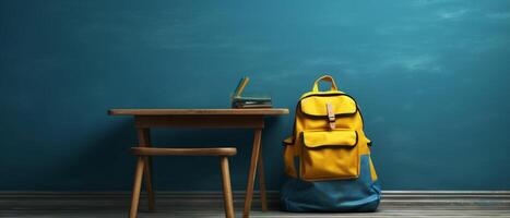 Table with chair and school bag in bright style with photo