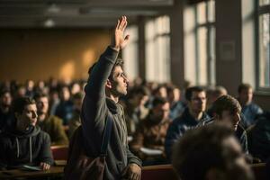 a male student raising hands at a lecture theatre with photo