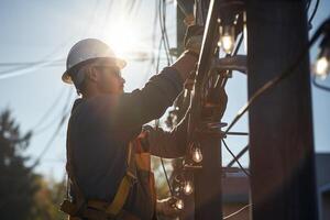 a electrician fixing power pole with photo