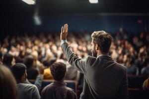 a male student raising hands at a lecture theatre with Generative AI photo