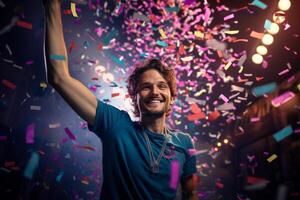 a happy winner on stage holding trophy in his hands with colorful light confetti with photo