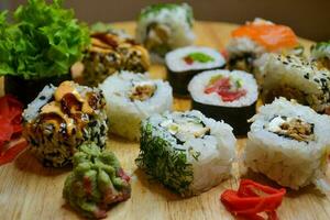 Japanese dinner with sushi rolls photo