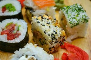 Japanese dinner with sushi rolls photo