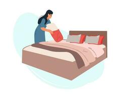 A woman is setting up a bed with a pillow. vector