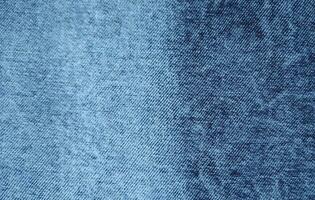 Light Blue denim fabric close up photography background, stone wash denim jeans cloth, denim texture, photo