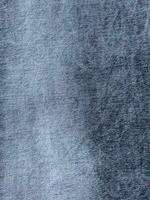 gris y azul mezclilla tela cerca arriba fotografía, mezclilla pantalones paño, mezclilla textura, índigo foto