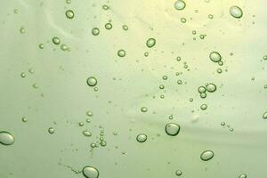 Green gel texture of a cosmetic care product. photo