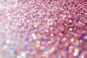 Abstract sequin background with shining festive bokeh. photo