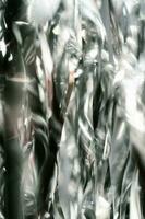 Abstract atmospheric background of tinsel with bokeh. photo