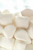 A stack of marshmallows on a white background. photo