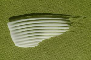 blanco crema textura en un verde antecedentes. foto