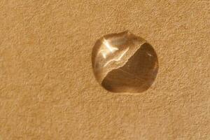 A drop of cosmetic product on a beige background. Texture. photo