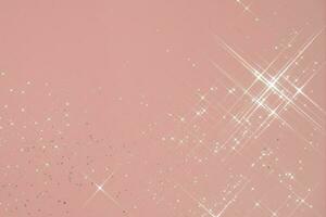 Abstract pink background with sparkles in the shape of stars. photo