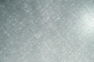 Abstract pink background with sparkles in the shape of stars. photo