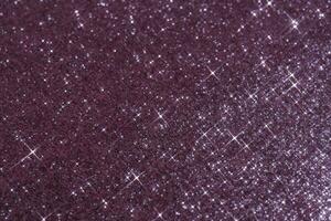 Abstract violet background with sparkles in the shape of stars. photo