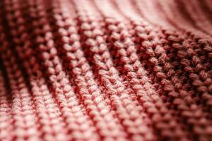 de punto textura de un rosado suéter o bufanda de cerca. foto