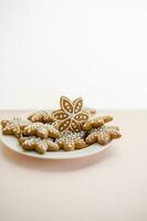 Ginger cookies on the on a delicate peach background. photo