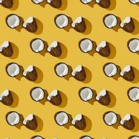 A pattern of coconuts on a bright yellow background. photo
