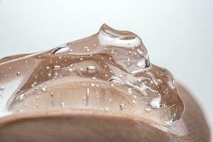 The texture of a thick cosmetic hyaluronic gel on the skin. photo