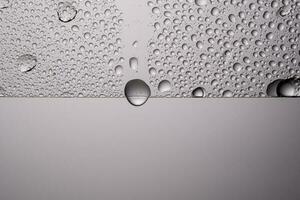 Drops of water on a transparent gray background. photo