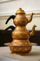 Turkish copper teapot with teapot close-up. photo