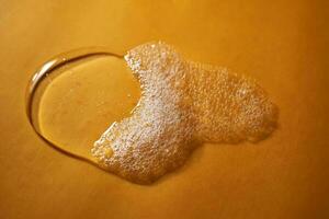 A drop of gel and the texture of the foam. It can be the texture of shampoo, shower gel or dishwashing detergent. photo