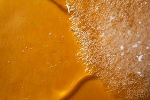 A drop of gel and the texture of the foam. It can be the texture of shampoo, shower gel or dishwashing detergent. photo