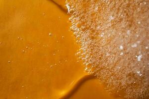 A drop of gel and the texture of the foam. It can be the texture of shampoo, shower gel or dishwashing detergent. photo