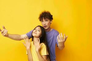 portrait of a man and a woman in colorful t-shirts posing friendship fun Lifestyle unaltered photo