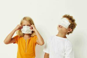 Cute preschool kids in medical mask protection posing grimace isolated background unaltered photo