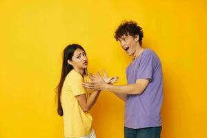 cute young couple casual clothes posing emotions antics isolated background unaltered photo