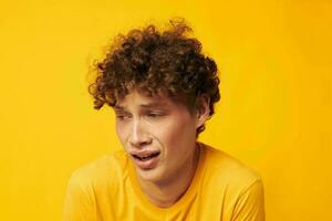 Young curly-haired man Youth style studio casual wear isolated background unaltered photo