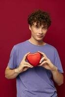 cute red-haired guy heart in hands gift romance photo