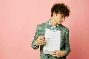 guy with red curly hair folder for papers blank sheet posing in suit isolated background unaltered photo