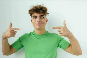 handsome guy in green t-shirts emotions posing unaltered photo