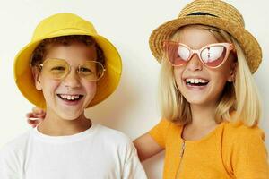 funny boy and girl wearing hats posing fashion light background photo