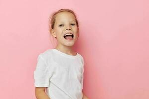 Portrait of happy smiling child girl in a white t-shirt smile childhood unaltered photo