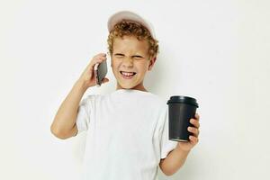 cute boy talking on the phone with a black glass isolated background unaltered photo