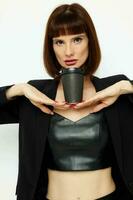 portrait of a woman in a suit glass of coffee posing isolated background photo