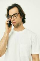 Cheerful man talking on the phone technologies isolated background photo