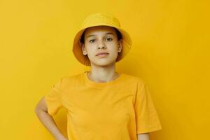 beautiful girl in a yellow t-shirt and Hat emotions summer style isolated background photo