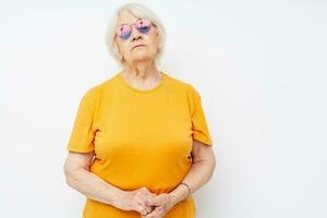 elderly woman in fashionable glasses hand gestures close-up emotions photo